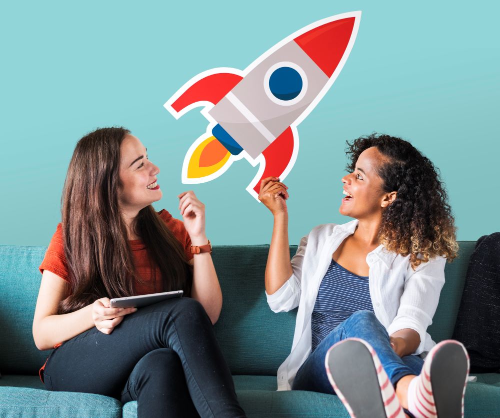 cheerful women holding rocket icon